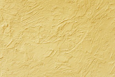 Duvarlardaki alçının dokusu bej boyayla boyanmıştır. Arka plan.