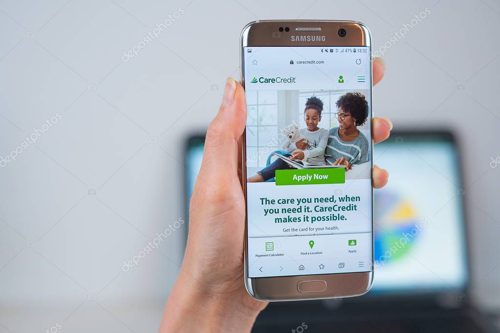Barcelona / Spain 05 25 2019: CareCredit web site on mobile phone screen. Mobile version of CareCredit company web page on smartphone. Official web page of CareCredit