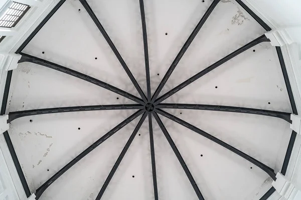 white ceiling round roof with a metal frame