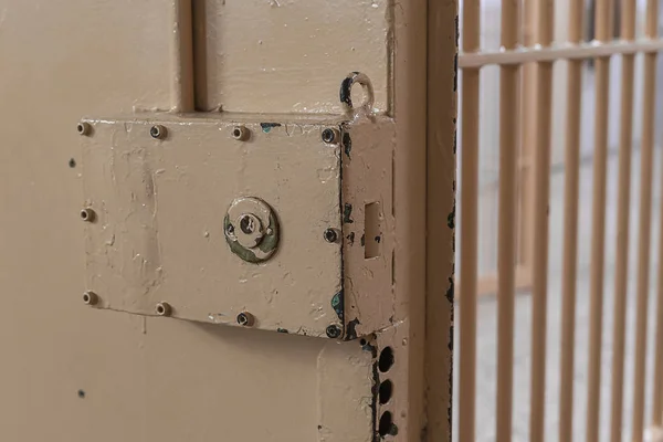 Big lock on prison door with bars. — Stock Photo, Image