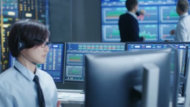 Network Operations Center Trader Makes Personal Client Call Headset Background — Stock Video