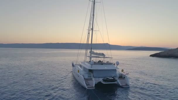 Tranquil Aerial Shot Catamaran Yacht Sailing Out Beautiful Bay Evening — Stock Video