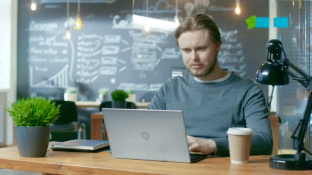 Handsome Young Office Employee Thinks Problem Solution While Typing Laptop — Vídeo de Stock