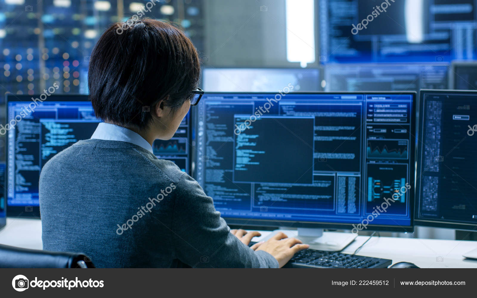System Control Room Technical Operator Works His Workstation