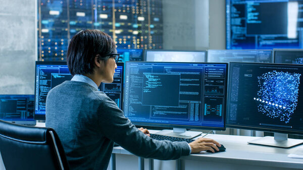 System Control Room Technical Operator Works His Workstation Multiple Displays Stock Photo