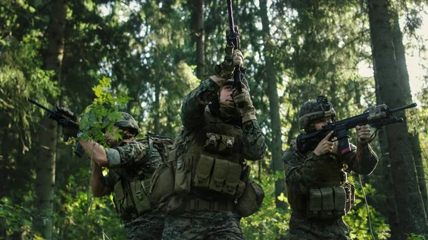 Three Fully Equipped Soldiers Wearing Camouflage Uniform Attacking Enemy Shooting — Stock Photo, Image