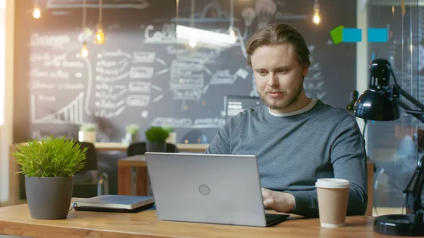 Handsome Young Office Employee Thinks Problem Solution While Typing Laptop — Fotografia de Stock