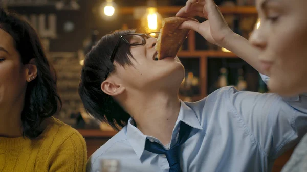 Bar Restaurant Hungry Asian Man Eats Slice Delicious Pizza Surrounded — Stock Photo, Image