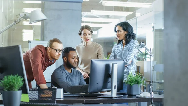 In Busy Corporate Office Team of Diverse Young Creative People Work on a Problem Solution. Collectively They Try to Help Coworker to Solve Problem.