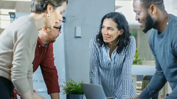 Diverse Group of Young Professionals Surround Conference Table and Collectively Try to Solve Problem.