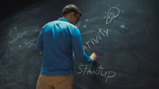 Time Lapse Young Man Drawing Blackboard Inspirational Keywords Business Start — Video