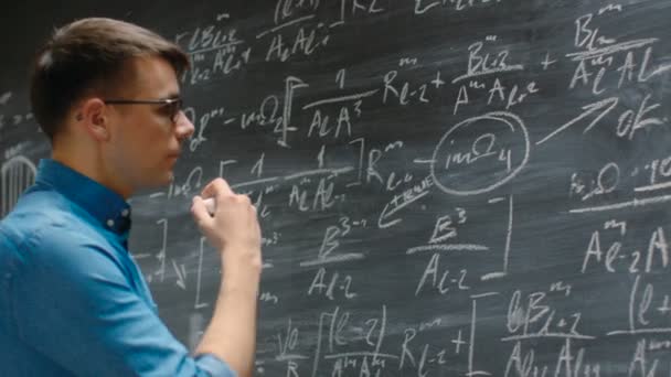 Brilliant Young Academic Finishes Writing Big Complex Mathematical Formula Equation — стоковое видео