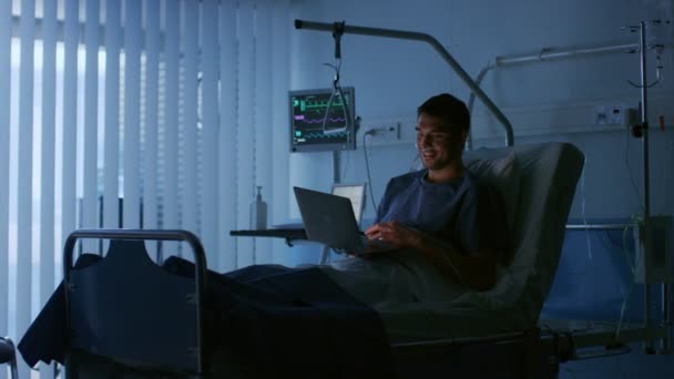 Hospital Recovering Male Patient Uses Laptop While Lying Bed Using — Stock Video