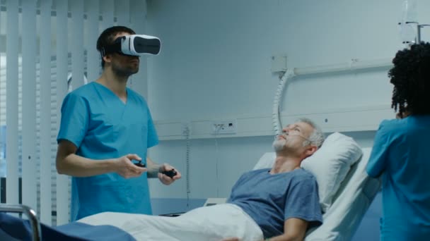 Doctor Wearing Virtual Reality Headset Holding Joysticks Cures Senior Patient — Stock Video