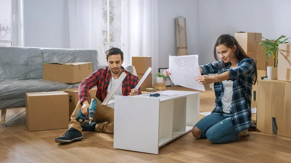 Funny and Confused Couple Assemble Furniture as a Team, Girl tri