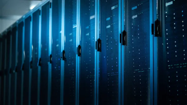 Low Angle Shot of a Working Data Center With Rows of Rack Servers. Led Lights Blinking and Computers are Working. — Stock Photo, Image