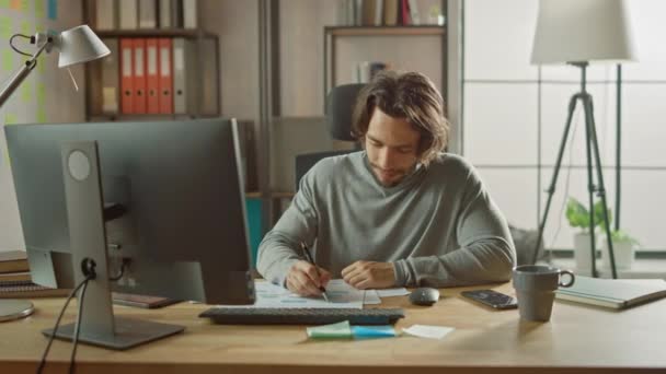 Handsome Long Haired Entrepreneur Sitting At His Desk In The