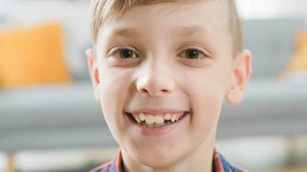 Portrait of Adorable Young Boy Smiling on Camera. In the Background Blurred Sunny Room. — Stock Photo, Image