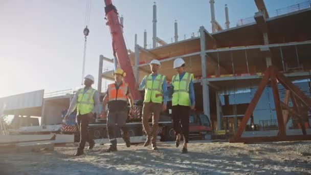 Diverse Team of Specialists Inspect Commercial, Industrial Building Construction Site Real Estate Project with Civil Engineer, Investor and Worker На задньому плані, рамки для оформлення хмарочосів — стокове відео