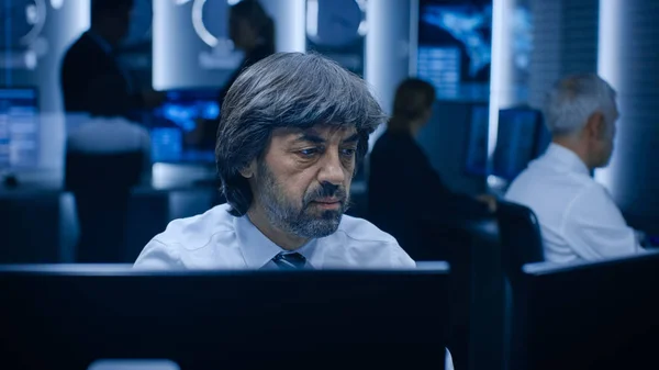 Professional Operators Working On Computers in System Control Room. Secret Government Agency Analysts Doing Research, Conducting Cyber Security Investigation. — Stock Photo, Image