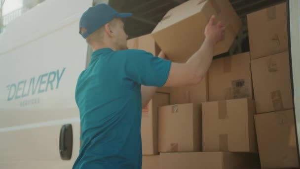 Courier Opens Delivery Van Side Door and Takes out Cardboard Box Package, Closes the Door and Goes on Delivering Postal Parcel. Slow Motion — Stock Video