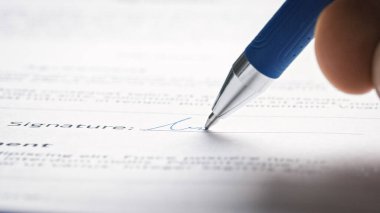 Person Signing Important Document. Camera Following Tip of the Pen as it Signs Crucial Business Contract. Mock-up 