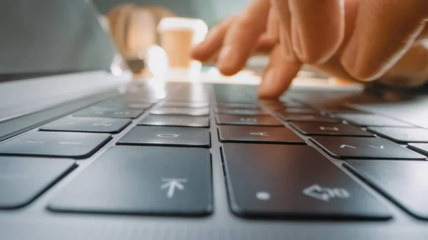 Close-up Moving Macro Shot: Person Typing on the Computer Keyboard. Working, Writing Emails, Using Internet. Notebook lying on the Tablet, Bright Sunny day in the Background — Stock Photo, Image