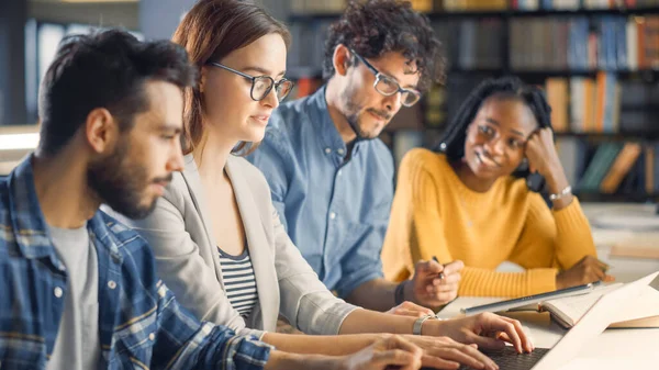 Diverse Team of Young Brilliant Internet Entrepreneurs and Office Specialists Have a Meeting, Talking, Using Laptops, Finding Solutions and Solving Problems. Talented Young People Working — Stock Photo, Image