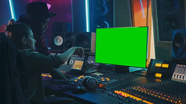 Producer and Audio Engineer Working together in Music Record Studio on a New Album, Use Green Screen Computer, Control Desk for Mixing and Creating Hit Song. Artist and Musician Collaboration — Stock Photo, Image