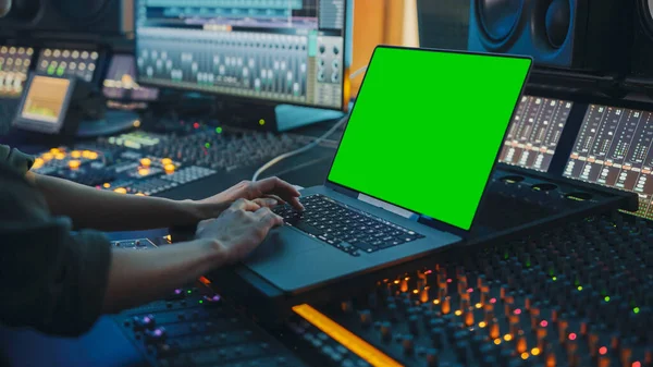 Female Artist, Musician, Producer, Audio Engineer Working in Music Record Studio on a New Album, Use Green Screen Laptop Computer, Control Desk for Mixing and Creating Hit Song