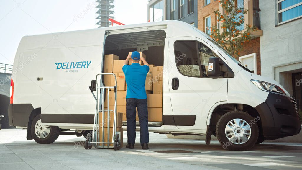 Delivery Man Uses Hand Truck Trolley Full of Cardboard Boxes and Packages, Loads Parcels into Truck Van. Professional Courier Loader helping you Move, Delivering Your Purchased Items Efficiently
