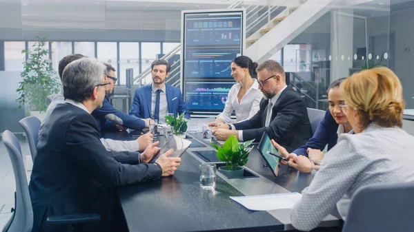 Group of Executives, Lawyers, Businesspeople and Investors Gather at the Table in Corporate Meeting Room to Discuss Business, Finance, Use Tablet Computers, Company Growth and Negotiation Strategy — Stock Photo, Image
