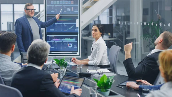 In the Corporate Meeting Room: Creative Director Uses Digital Interactive Whiteboard for Presentation to a Board of Executives, Lawyers, Investors. Screen Shows Company Growth Data with Digital Graph — Stock Photo, Image