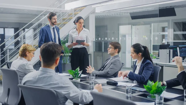 In the Corporate Office Meeting Room: Male and Female Company Growth and Development Executives Deliver a Speech to a Board of Directors Sitting at the Conference Table — Stock Photo, Image