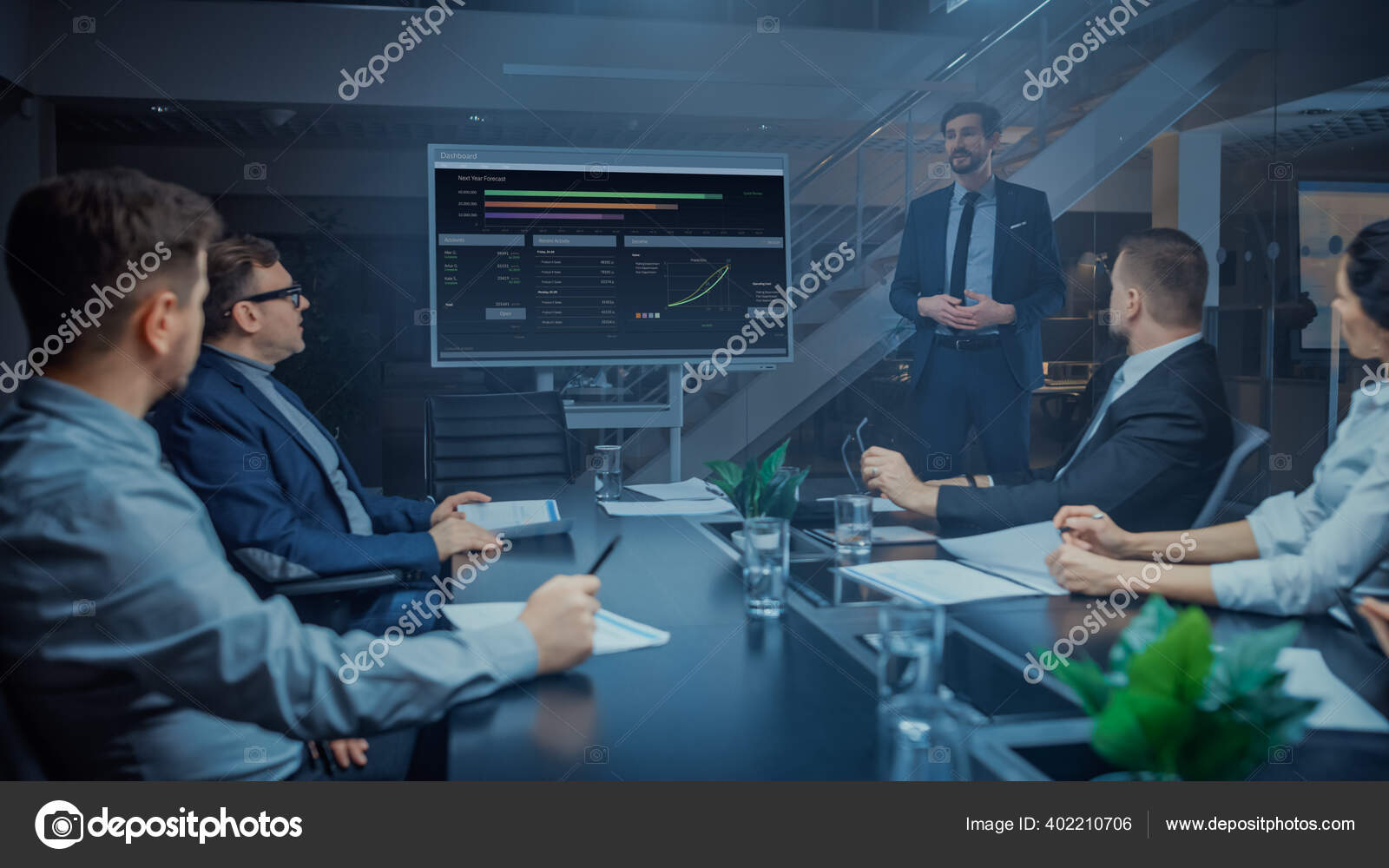 In the Corporate Meeting Room Male Executive Talks and Uses Digital