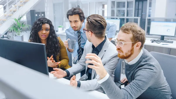 In Modern Office: Diverse Team of Young Motivated Businessmen and Businesswoman Work on Computer, Having Discussion, Finding Problem Solution Collectively. Ambitious Businesspeople Successful Teamwork — Stock Photo, Image