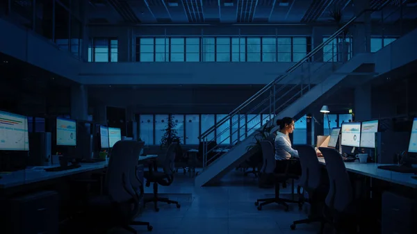 Alone Working Late at Night in the Office: Businesswoman Using Desktop Computer, Analyzing, Using Documents, Solving Problems, Finishing Project — 스톡 사진