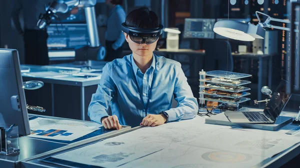Professional Japanese Development Engineer is Working in a AR Headset, Working with Virtual Graphics Drawings in the High Tech Research Laboratory with Modern Computer Equipment.
