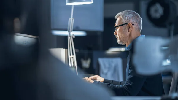 Shot of Industrial Engineer Working in Research Laboratory Development Center, Using Computer. He is Working on New Efficient Engine Concept Design. — Stock Photo, Image