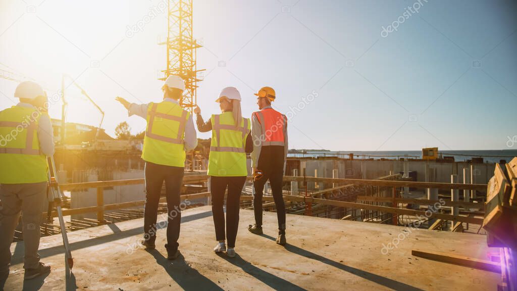 Diverse Team of Specialists Are on Construction Site. Real Estate Building Project with Civil Engineer, Architect, Business Finance Investor Discussing Planning and Development Details. Warm Sun Flare