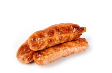 Meat sausages with glitter on a light background. Fried sausage. The concept of traditional cuisine.