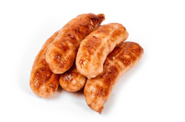 Meat sausages with glitter on a light background. Fried sausage. The concept of traditional cuisine.