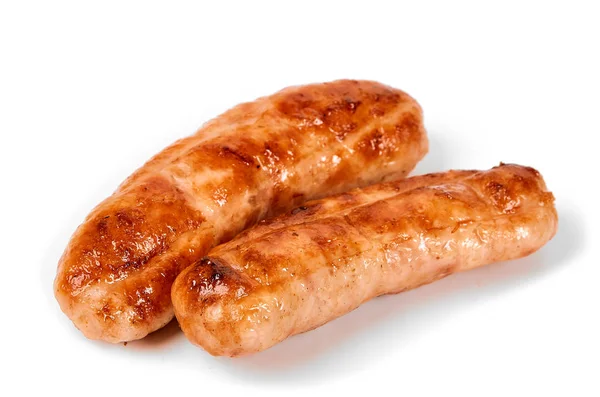 Meat sausages with glitter on a light background. Fried sausage. The concept of traditional cuisine. — Stock Photo, Image