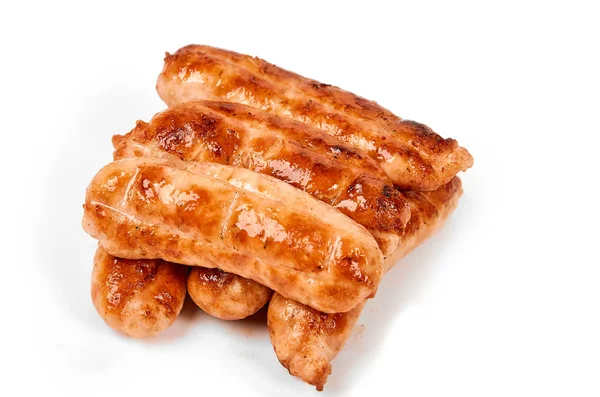 Meat sausages with glitter on a light background. Fried sausage. The concept of traditional cuisine. — Stock Photo, Image