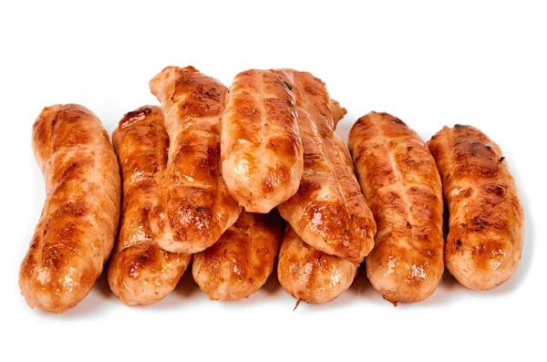 Meat sausages with glitter on a light background. Fried sausage. The concept of traditional cuisine.