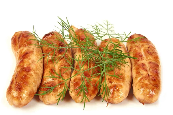 Işık arka planda Glitter ile et sosis. Kızarmış sosis. Geleneksel mutfak kavramı. Yeşiller ile sosis 