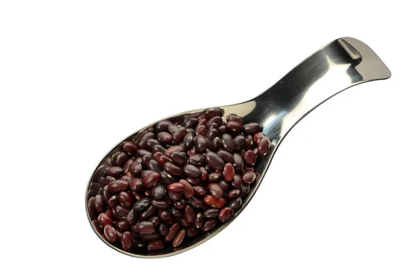 Frijoles rojos en una cuchara sobre un fondo aislado vista superior . — Foto de Stock