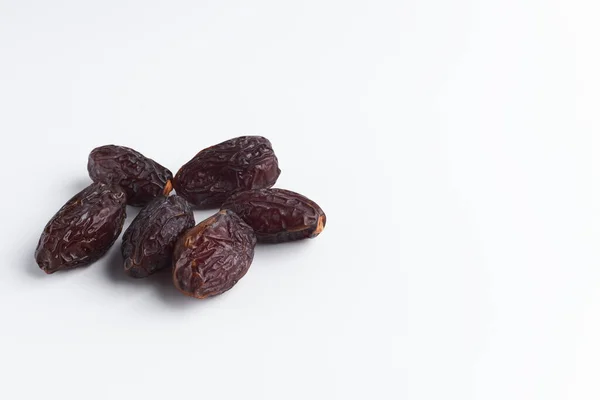 Handful of sluggish dates on a white background. dried fruits isolate. copy space for text — Stock Photo, Image