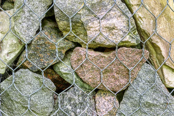 Arka plan çeşitli kayalar büyük ve küçük, granit kum metal örgü için