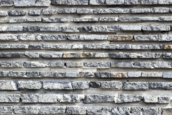 Arka plan kullanımı için siyah taş duvar. Eski taş duvar. Taklit taşı. Doğal taş.